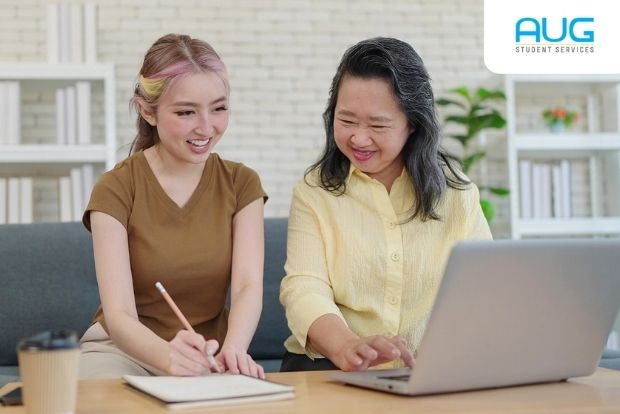 International Students calculating the cost of studying in the UK on a university campus