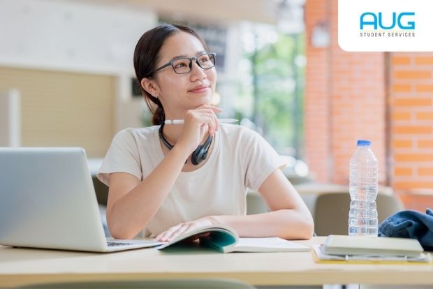 Student holding a CAS letter while preparing a UK Student Visa application