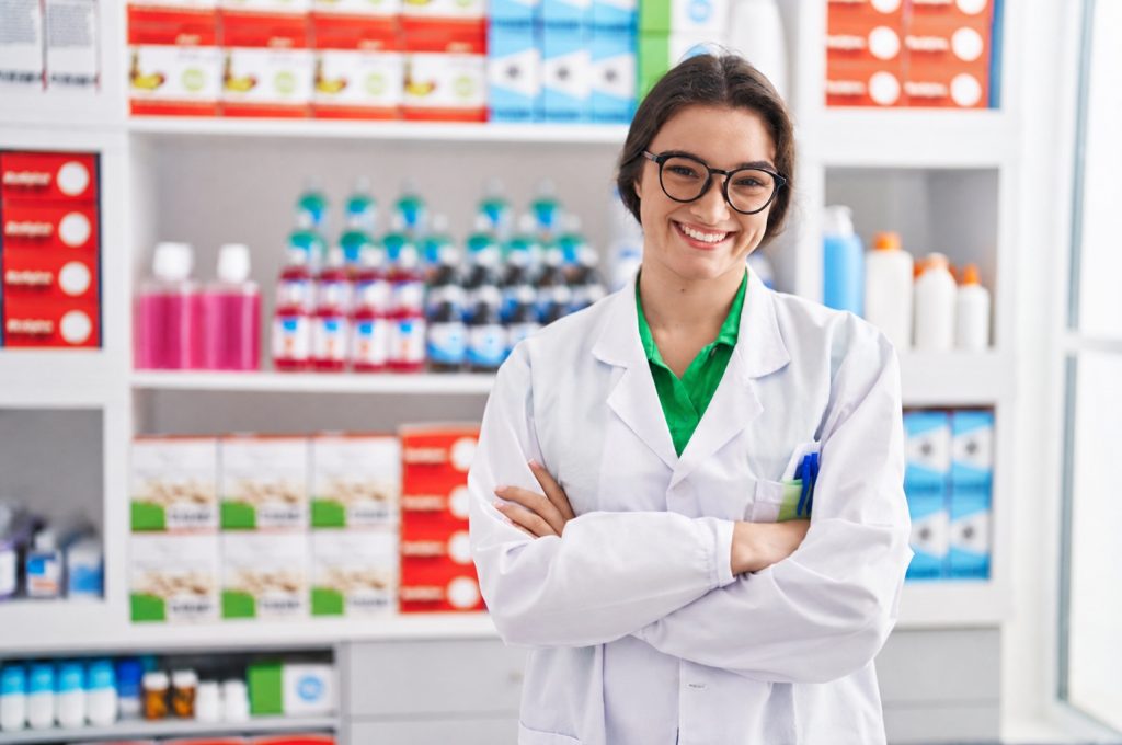 Pharmacist in Malaysia dispensing medicine to a patient at a community pharmacy